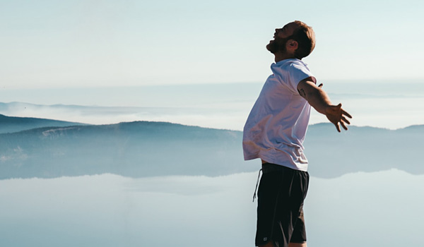 Happy man at a summit
